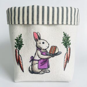 Kate's Threads canvas countertop bucket embroidered with a lady bunny serving carrot cake
