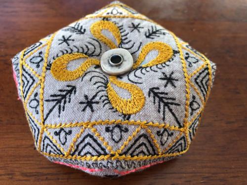 Custom embroidered biscornu French pin cushion embroidered with gold and black Russian mezen embroidery motifs